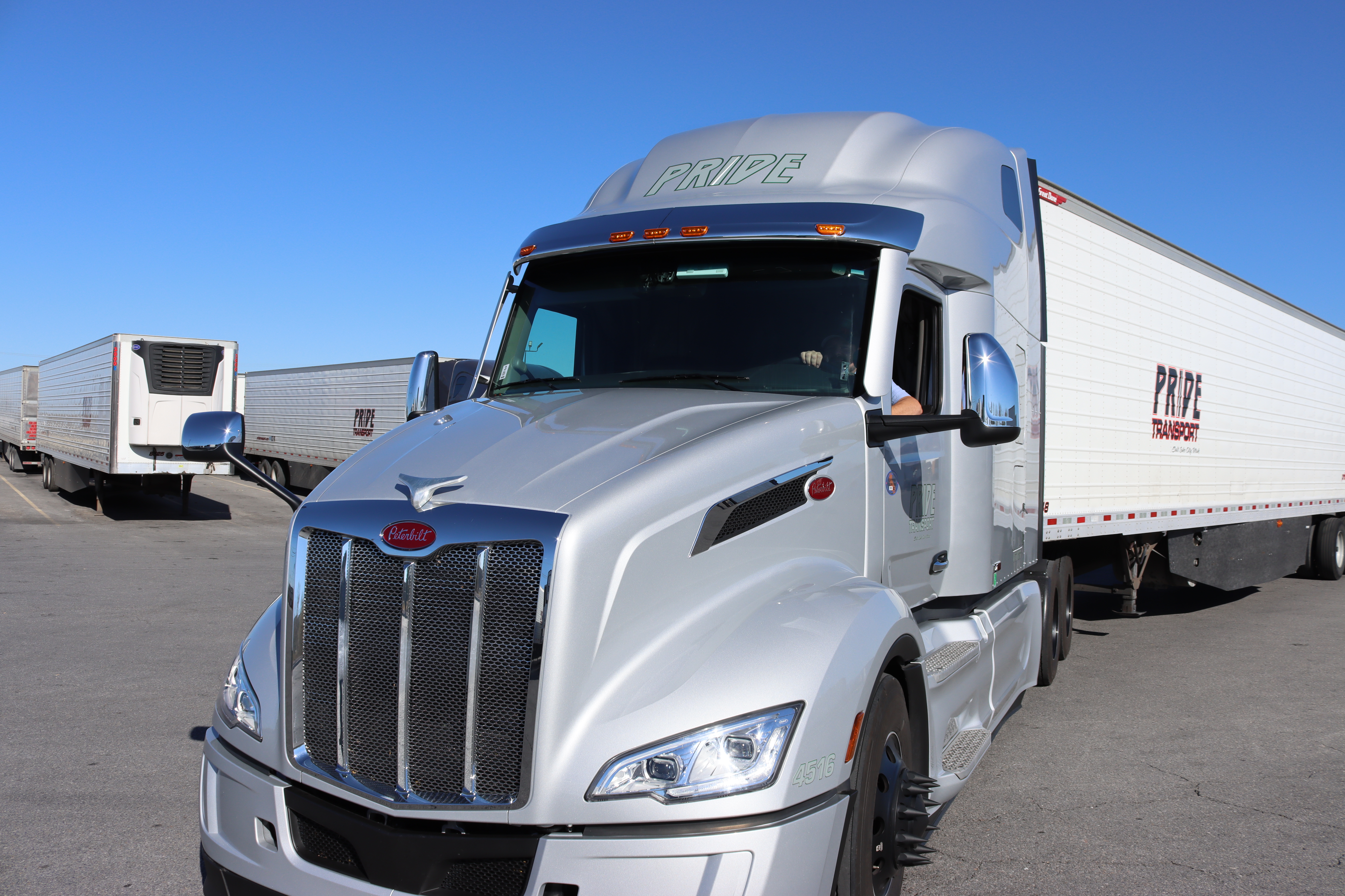grey pride transport truck