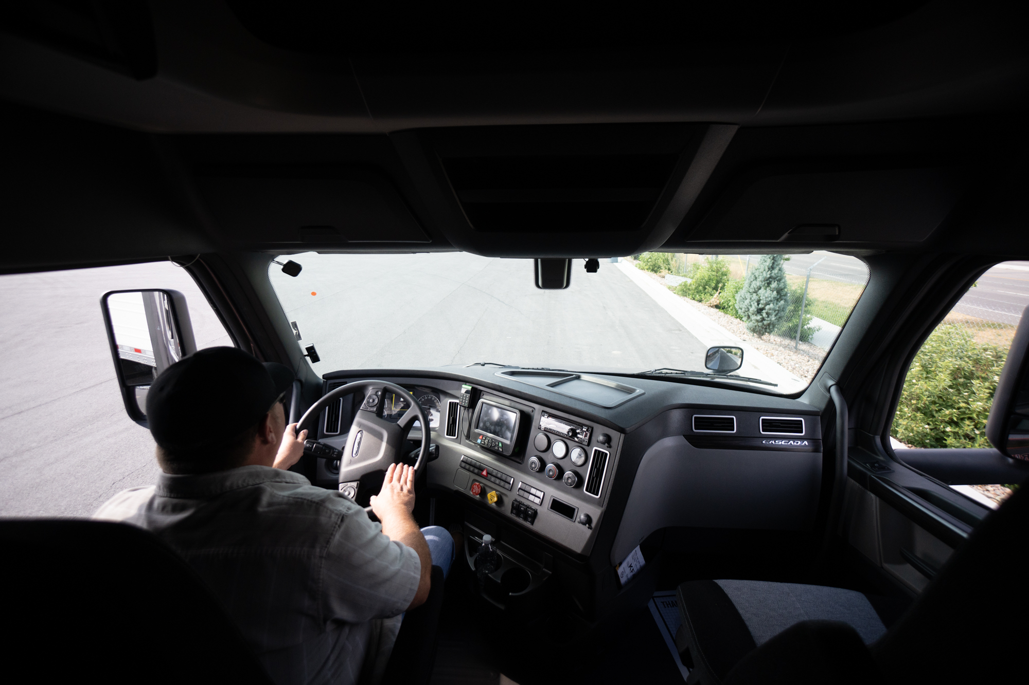 View from the inside of a truck with a Pride employee driving