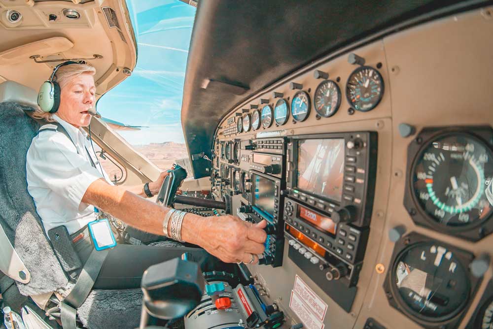 female airline pilot flying a plane