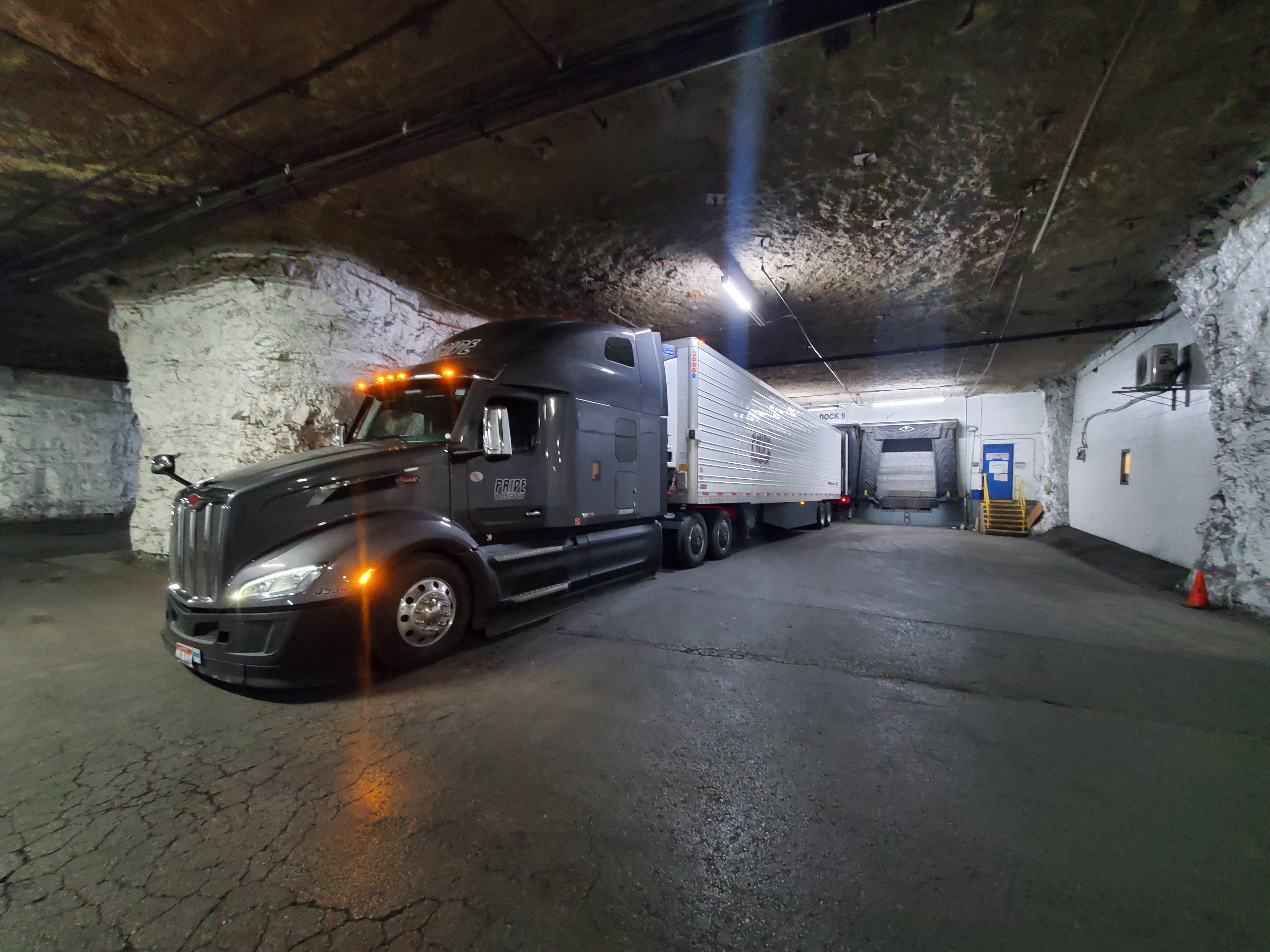 pride transport truck in cave loading dock