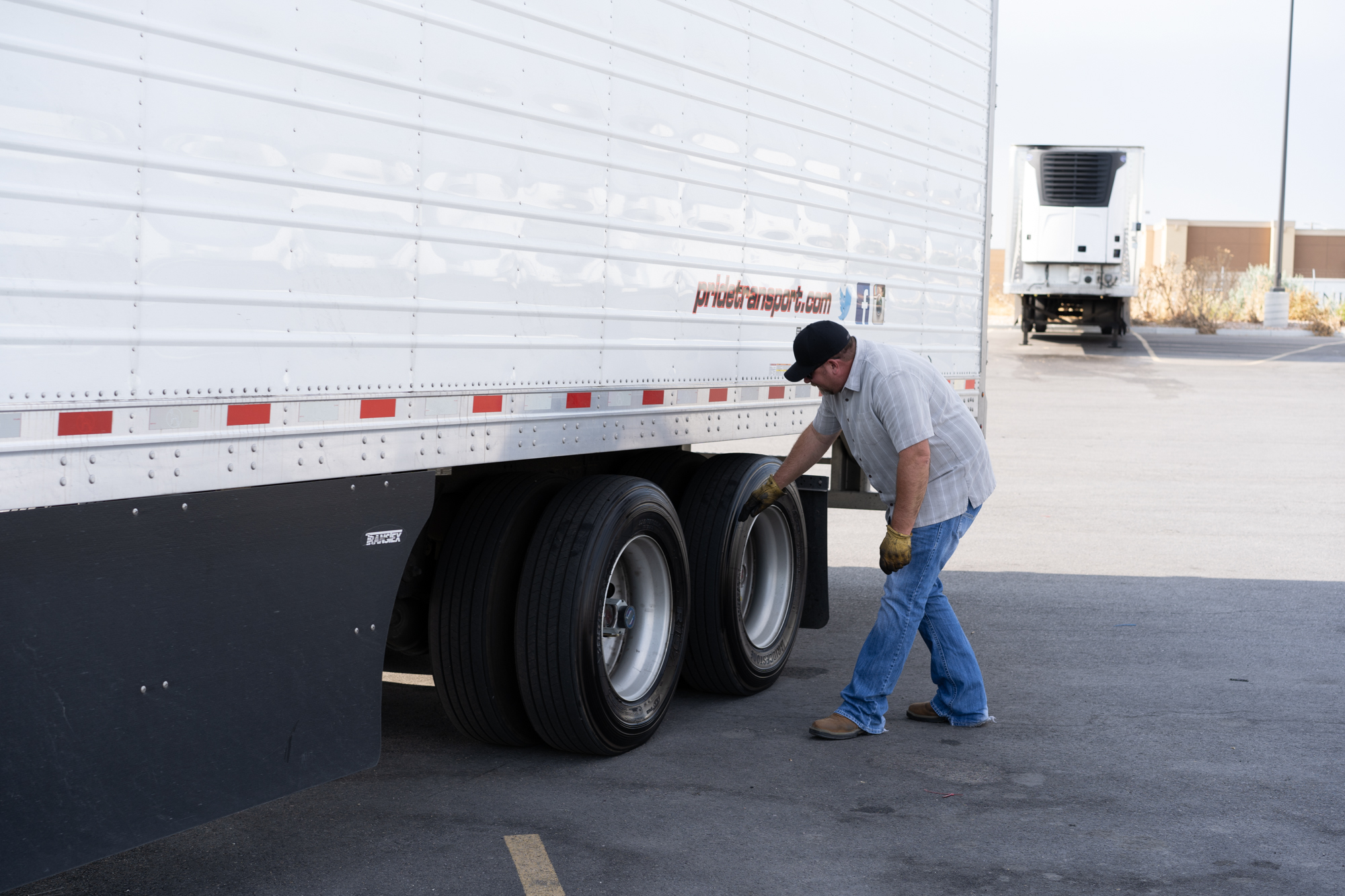 pride transport driver checking truck