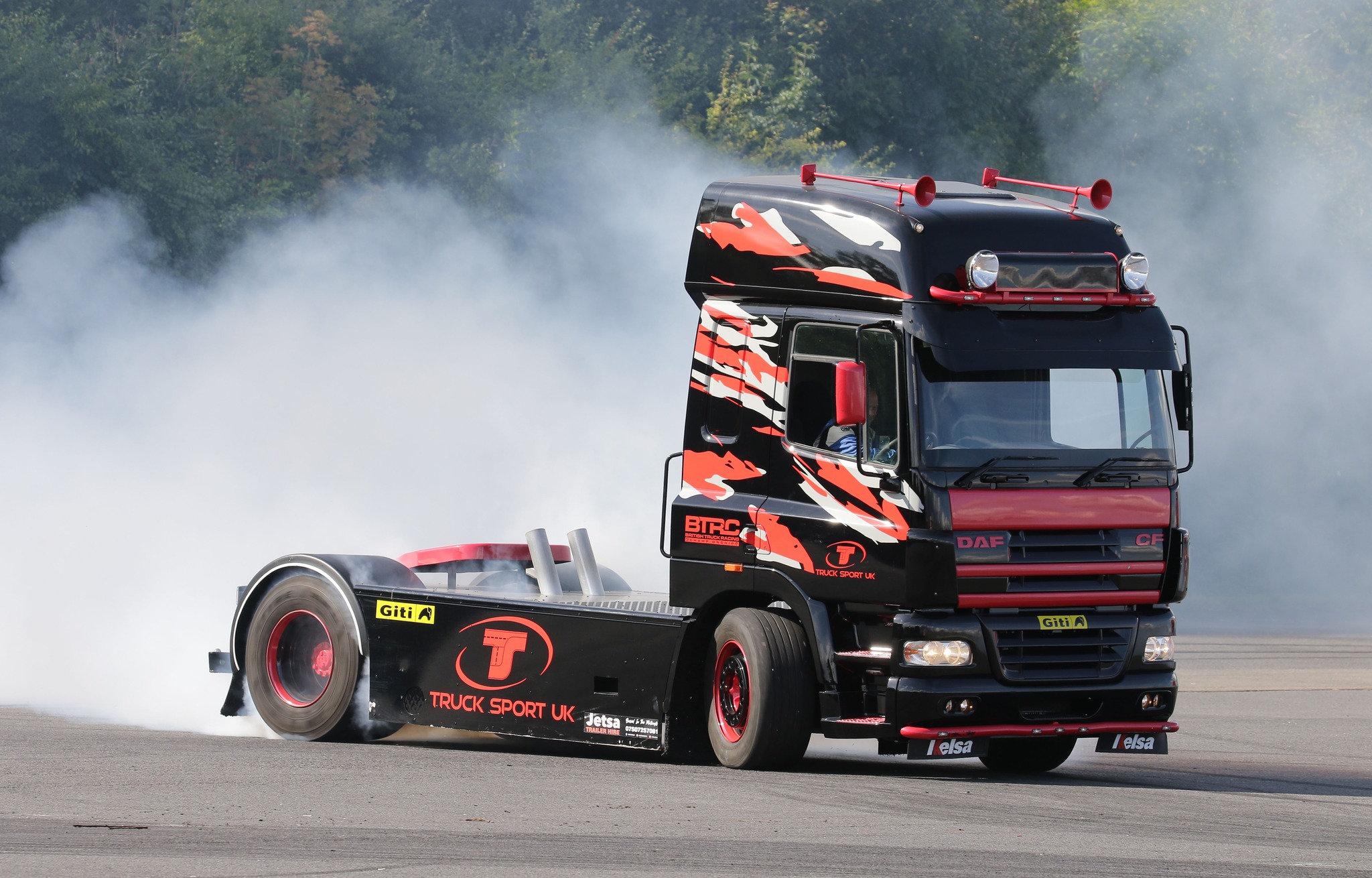 smoke from truck racing at convoy in the park