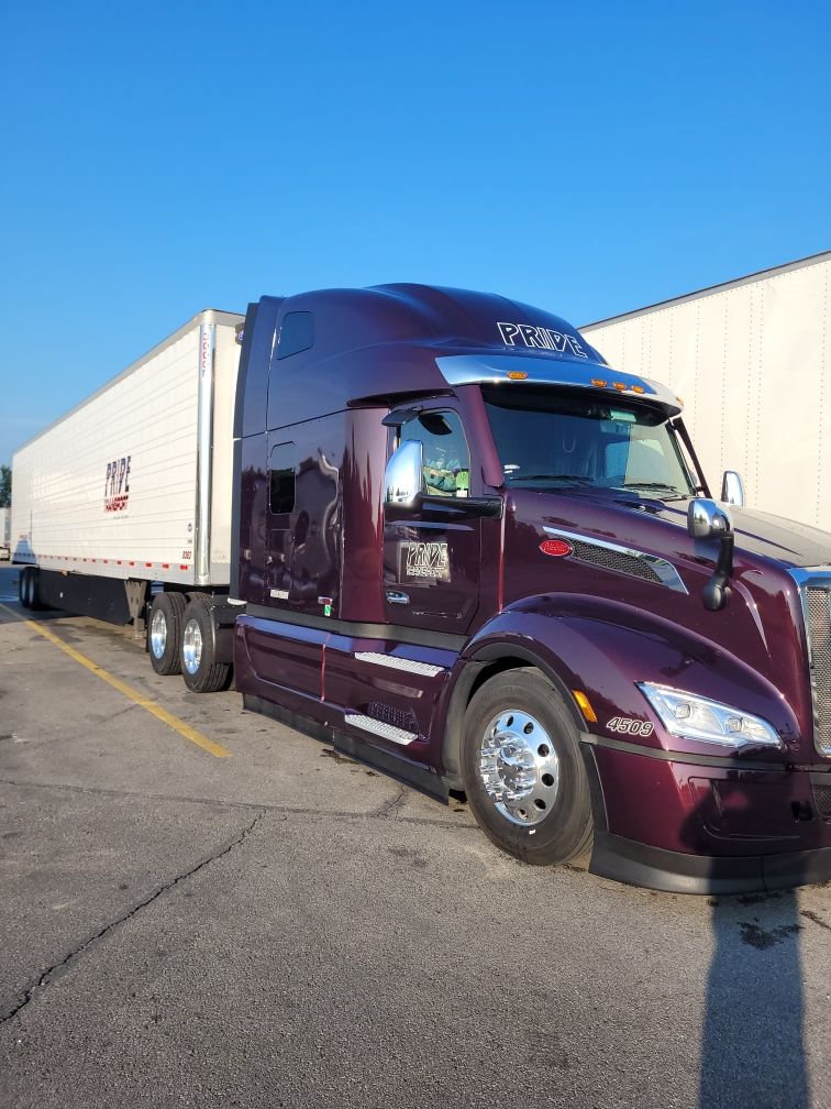 maroon pride transport truck parked