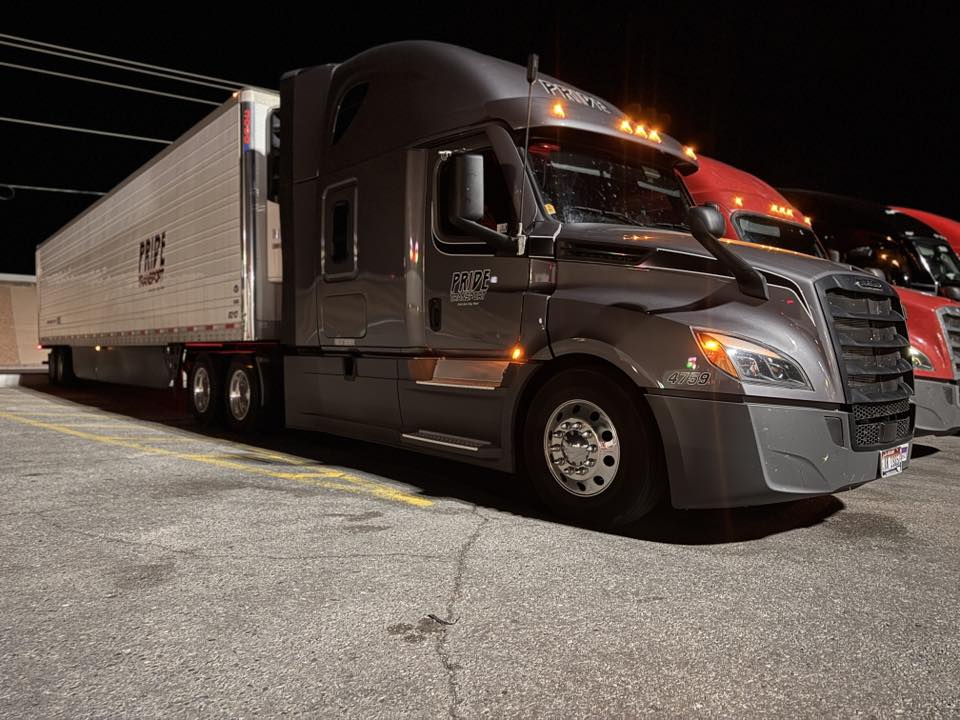 pride transport truck parked at night