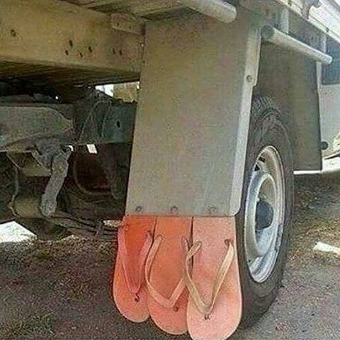 flip flops used as mud flaps on a truck
