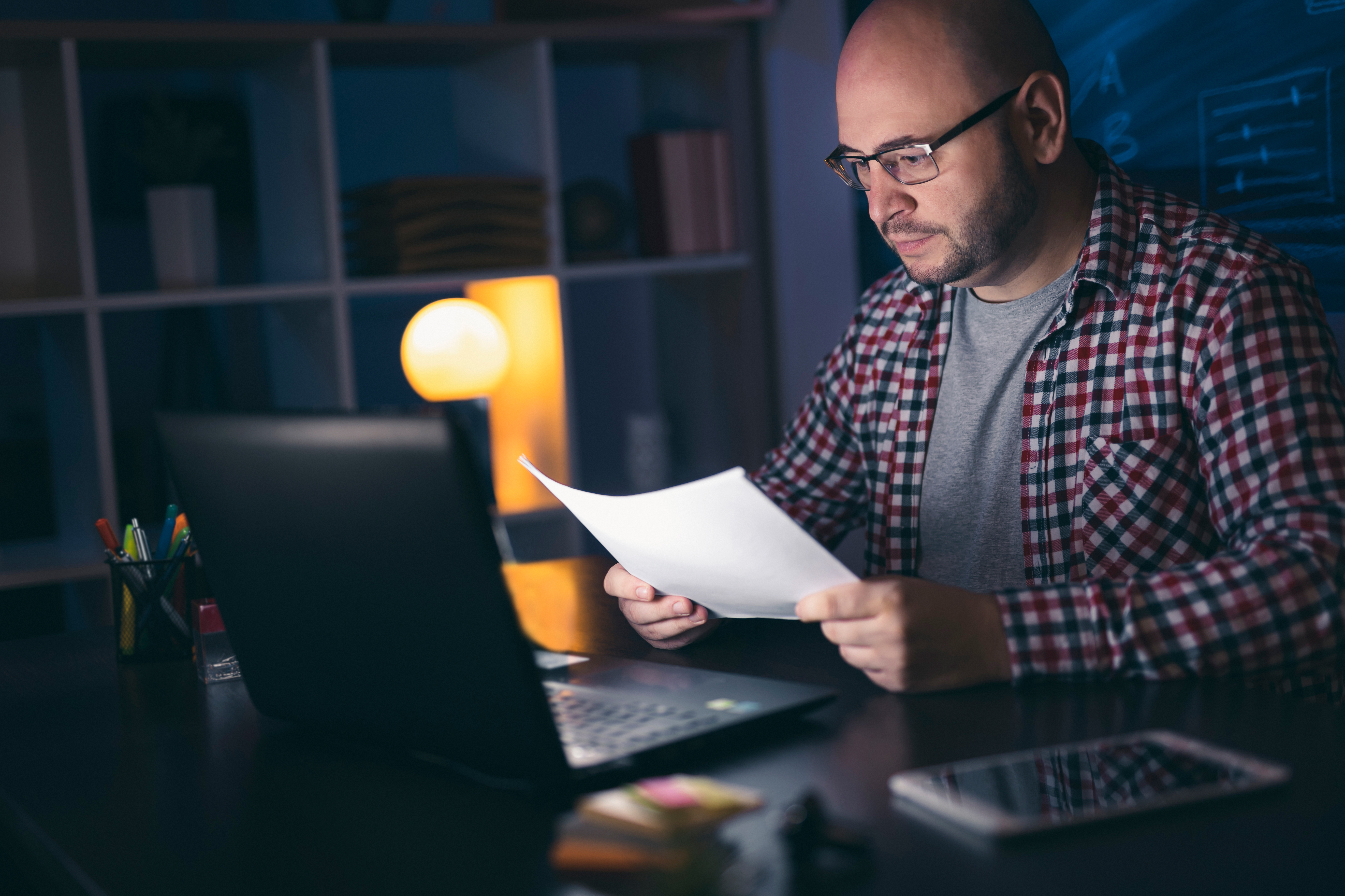 man reading something on a piece of paper