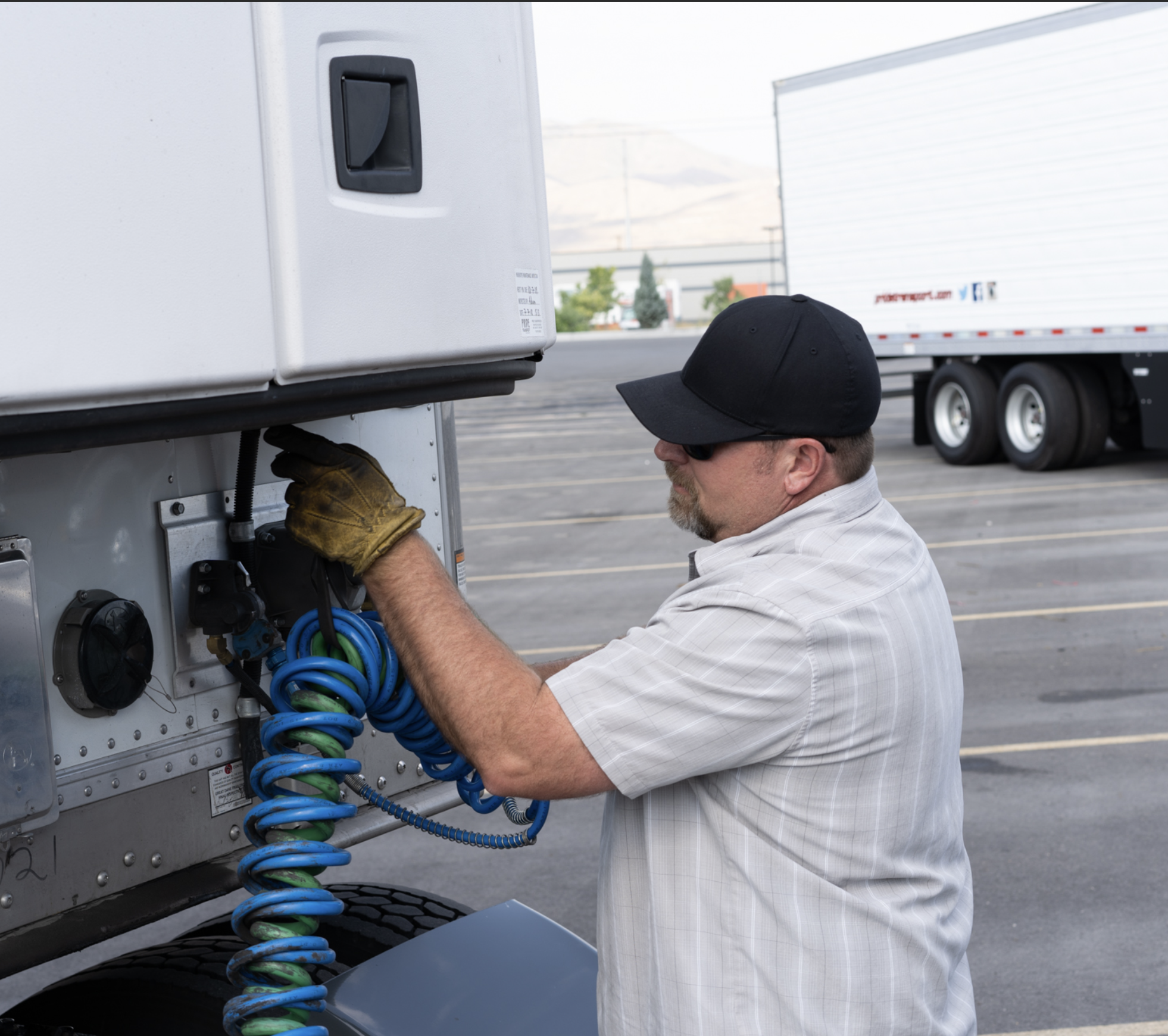 pride transport employee working on a pride truck