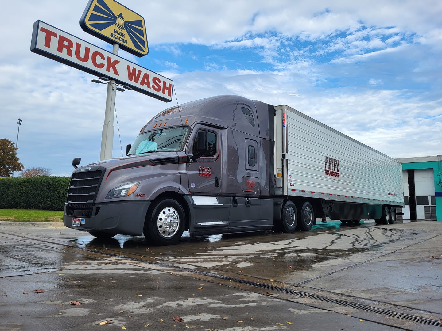 a Pride Transport truck in a truck wash station