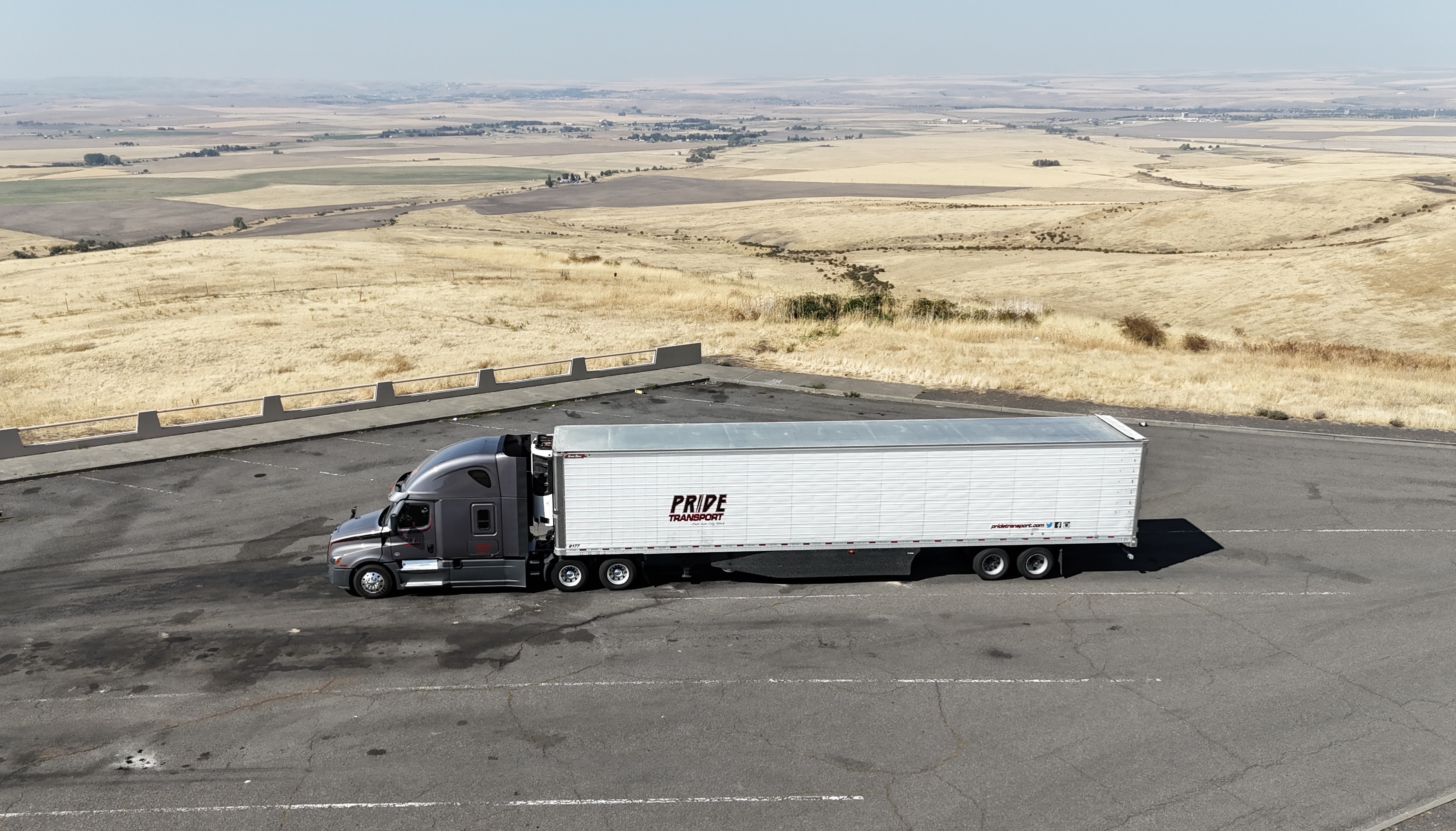 drone photo above pride transport truck in parking lot