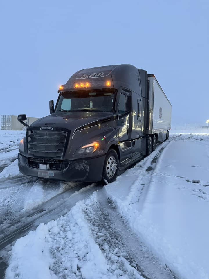 pride transport truck in snow