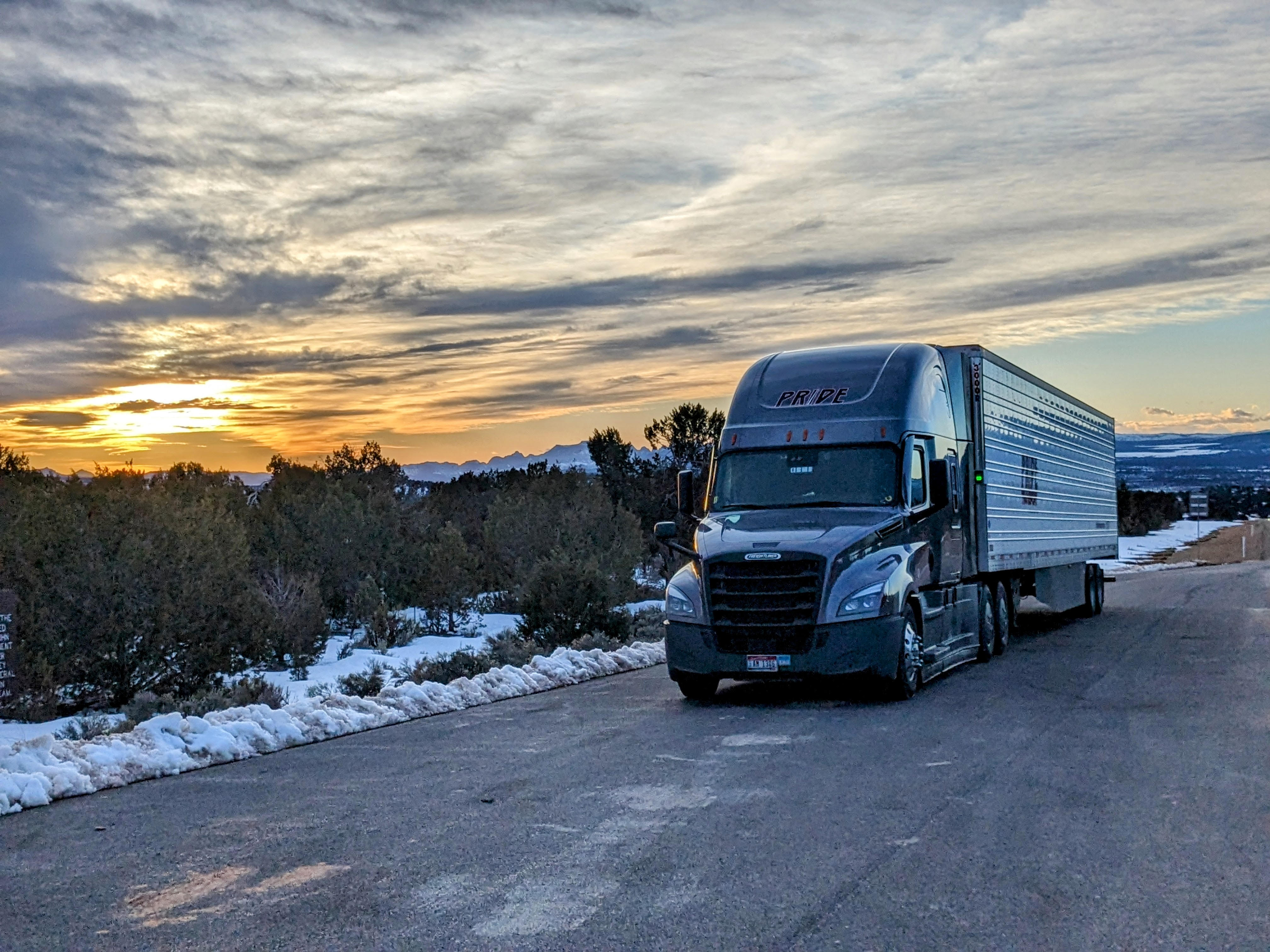 pride transport truck with snow