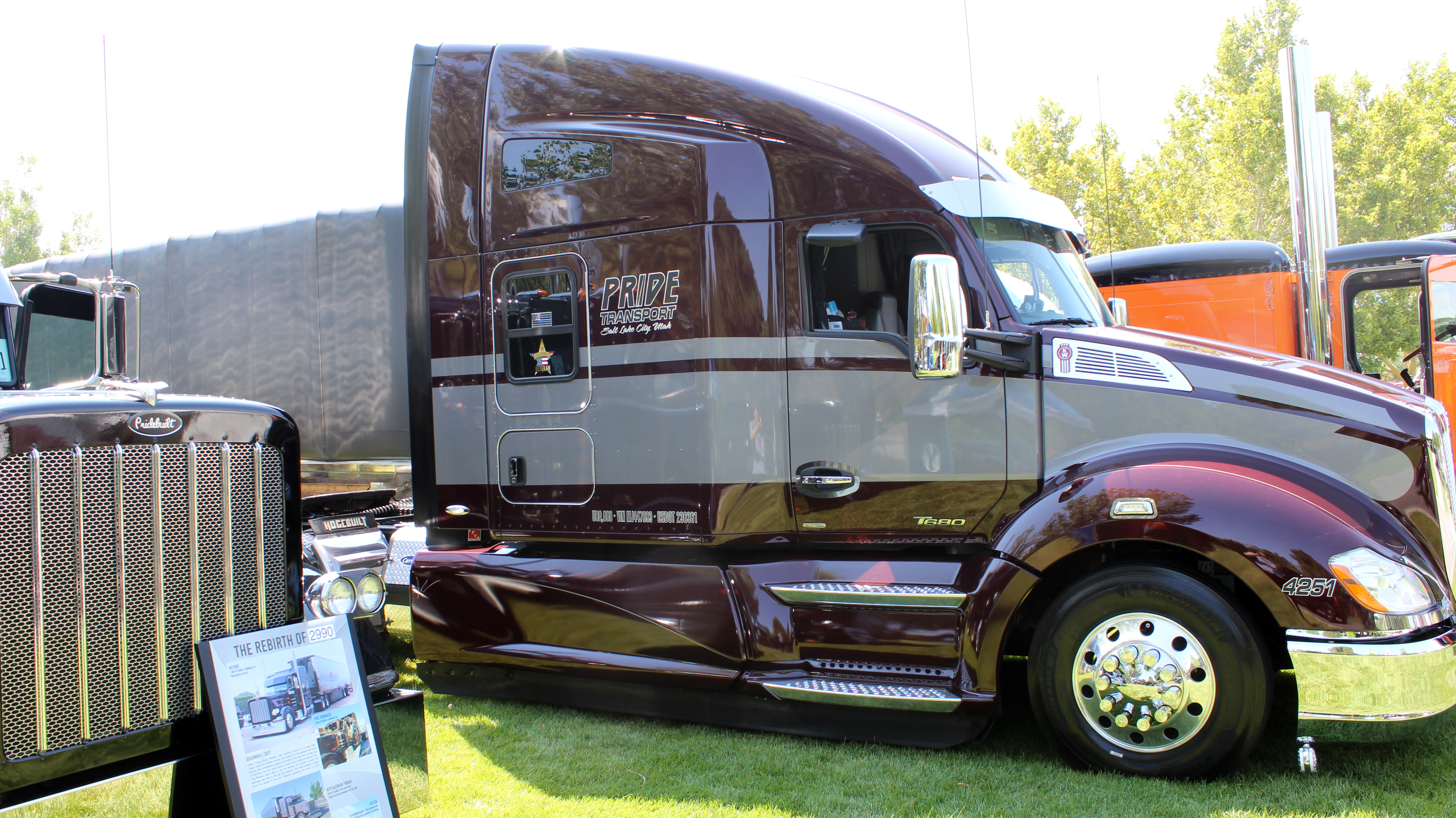 maroon pride transport truck at truck show in grass
