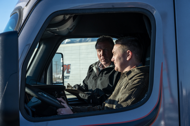 pride transport driver smiling out of driver window