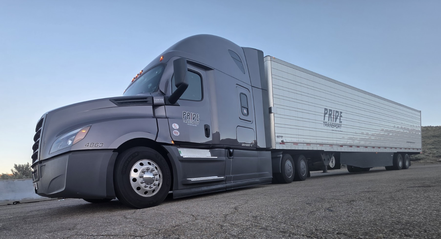 side view of pride transport truck parked