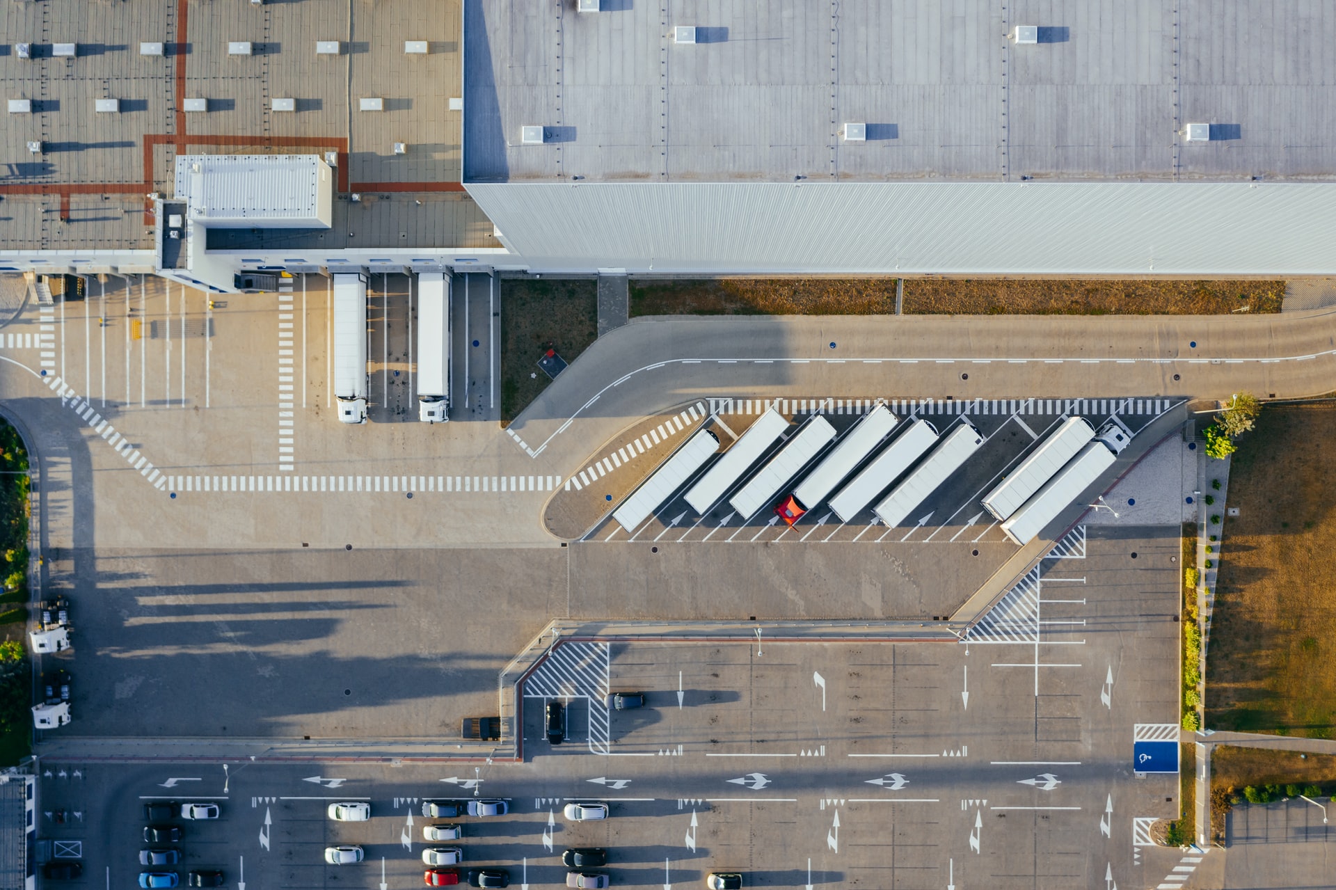 ariel view of trucks dropping off goods at warehouse