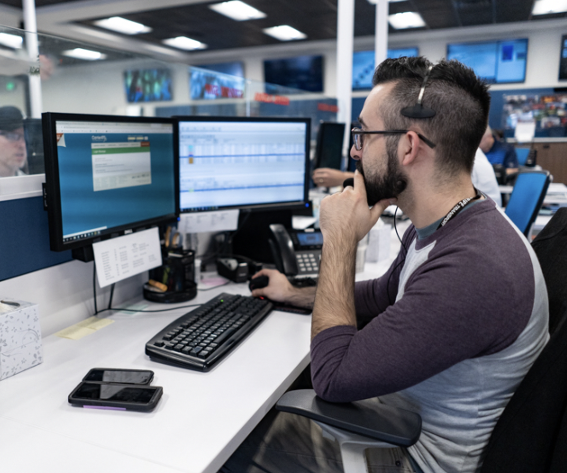 man working in the office behind a desk at Pride Transport