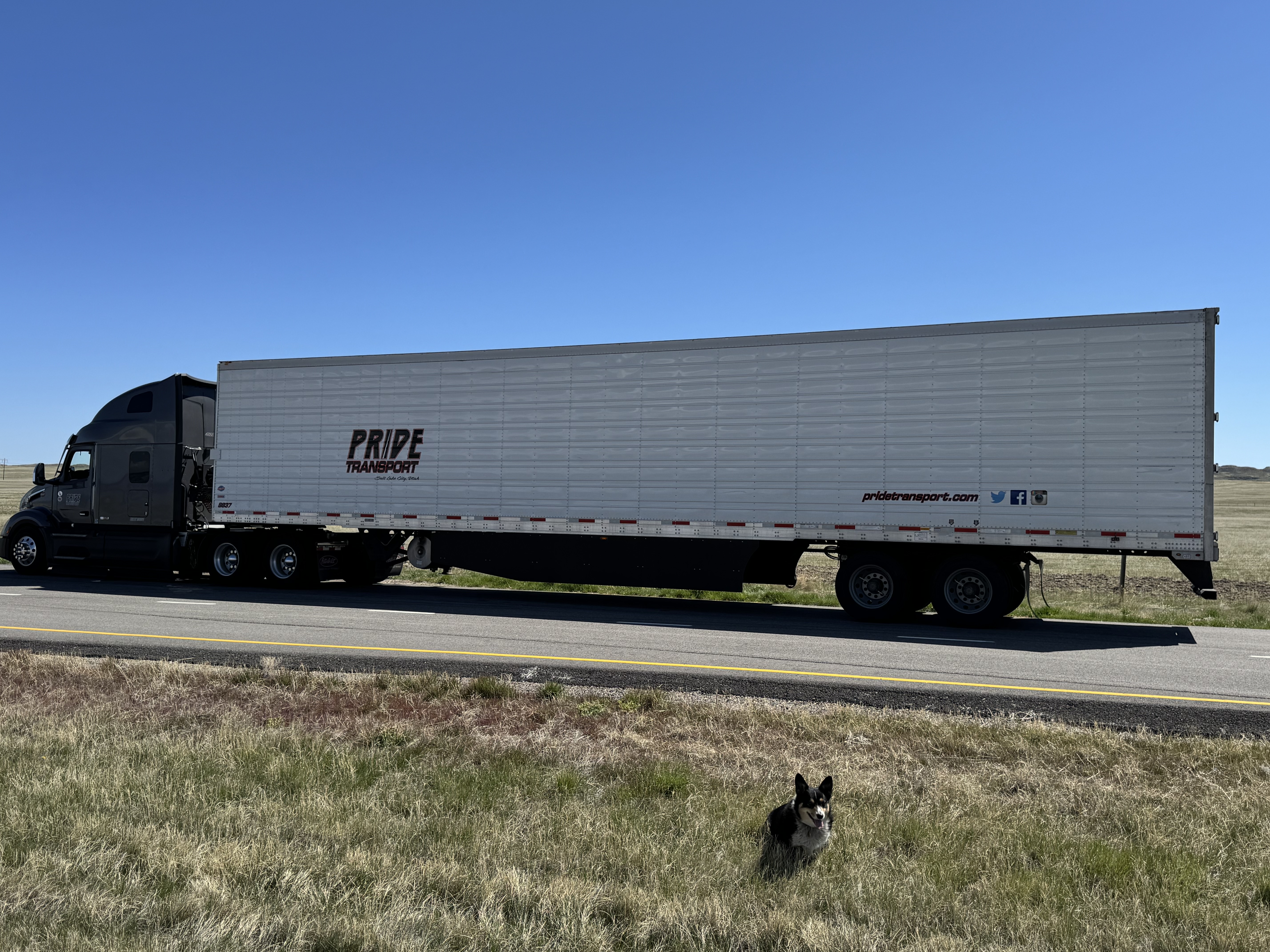 pride transport truck parked on the side of road