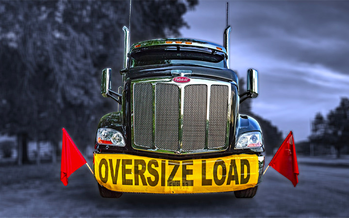 over sized load sign on front of semi-truck