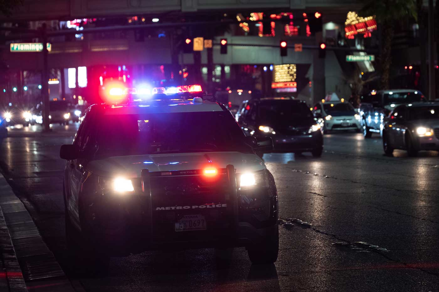 car cop at night with lights on