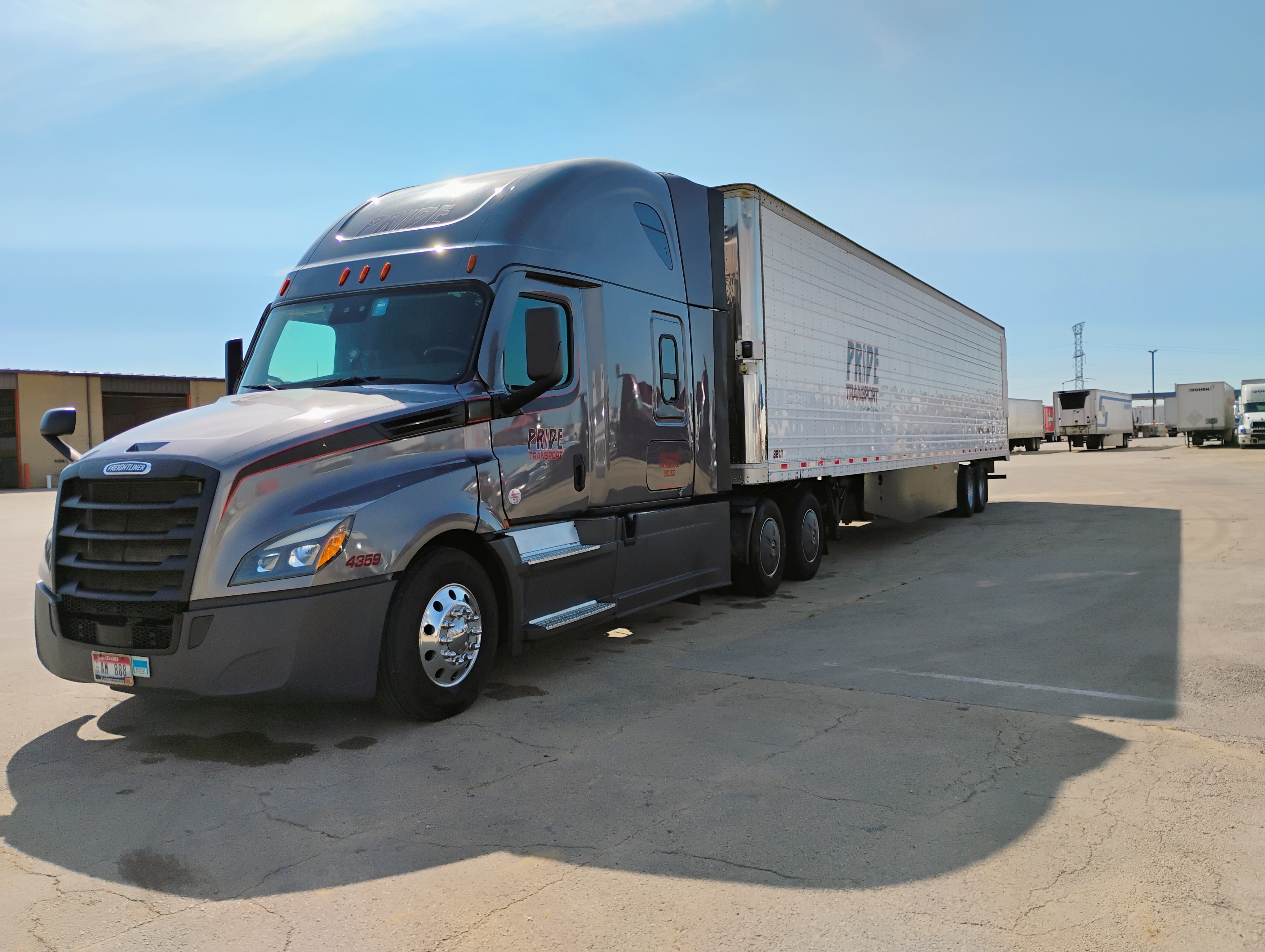 pride transport truck parked in lot 
