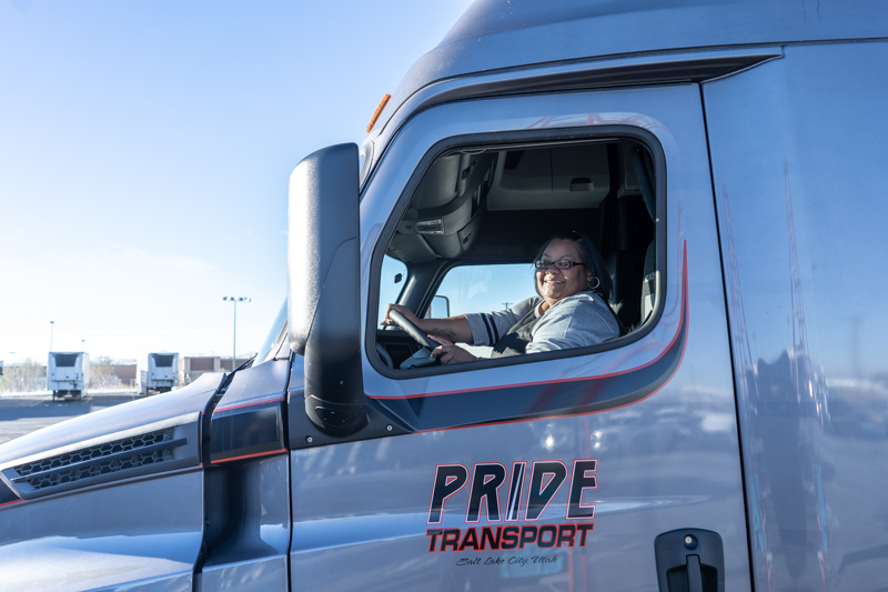 woman in drivers seat of pride truck