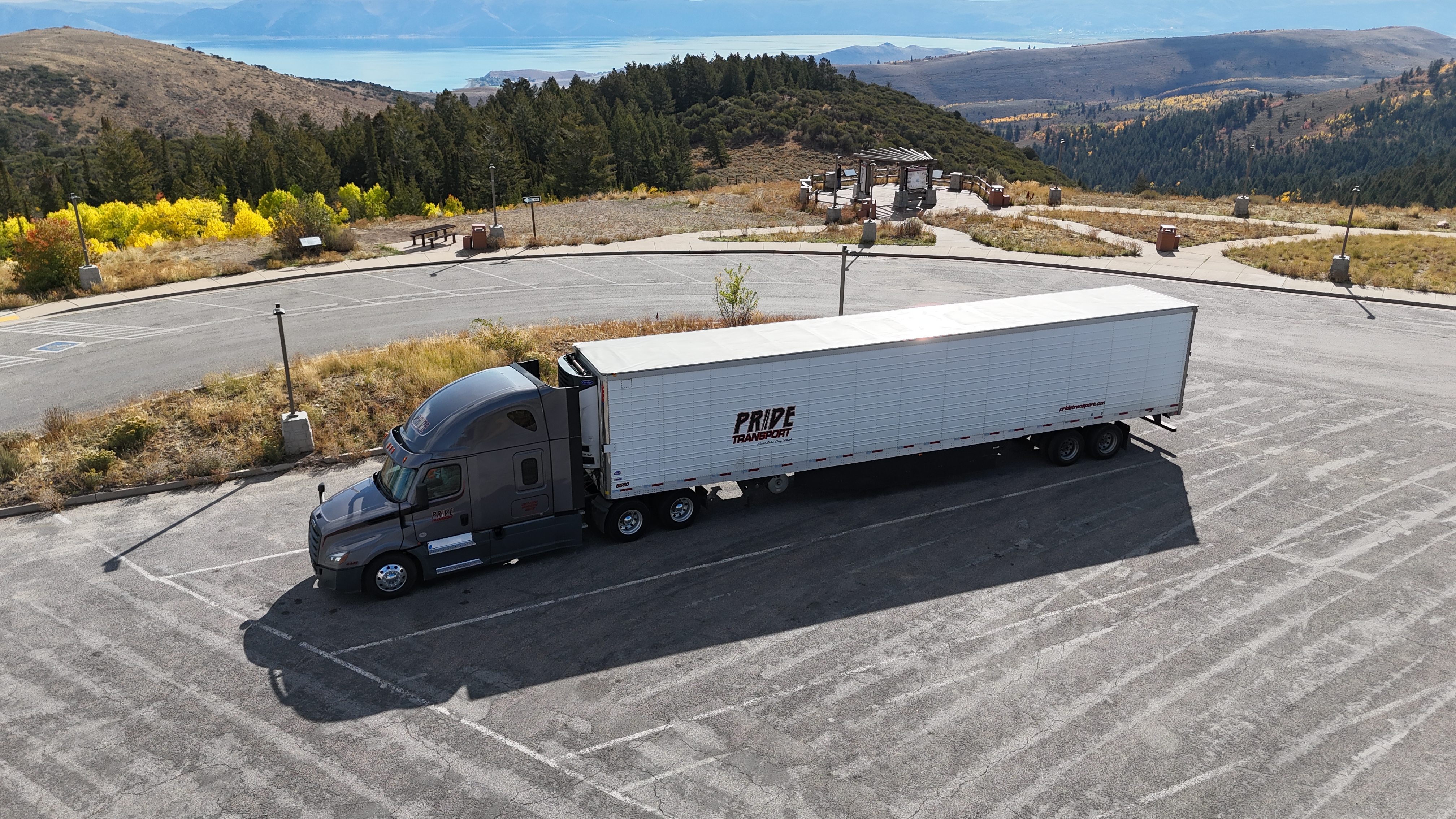drone photo of pride transport truck parked in empty lot