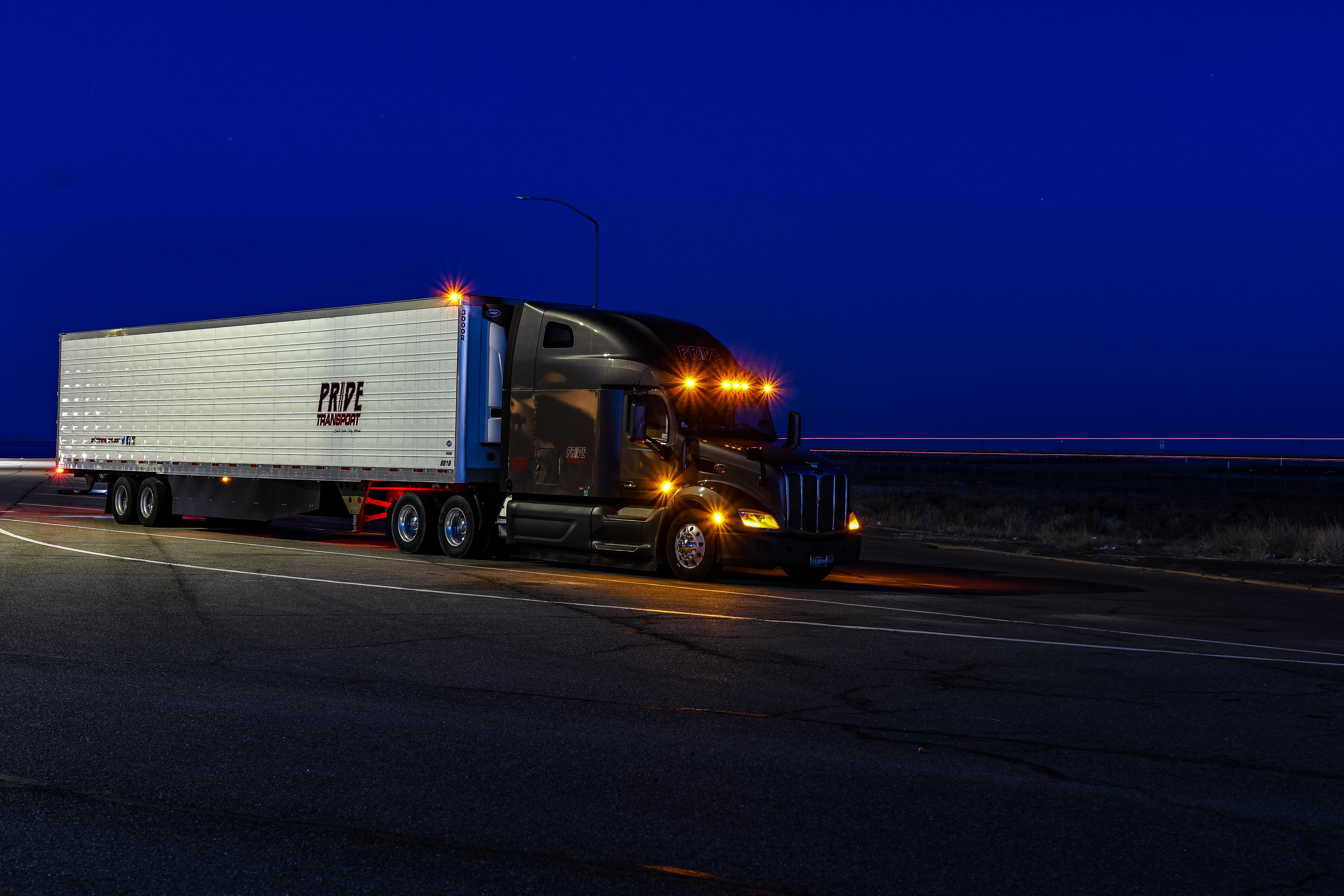 pride transport truck parked at night