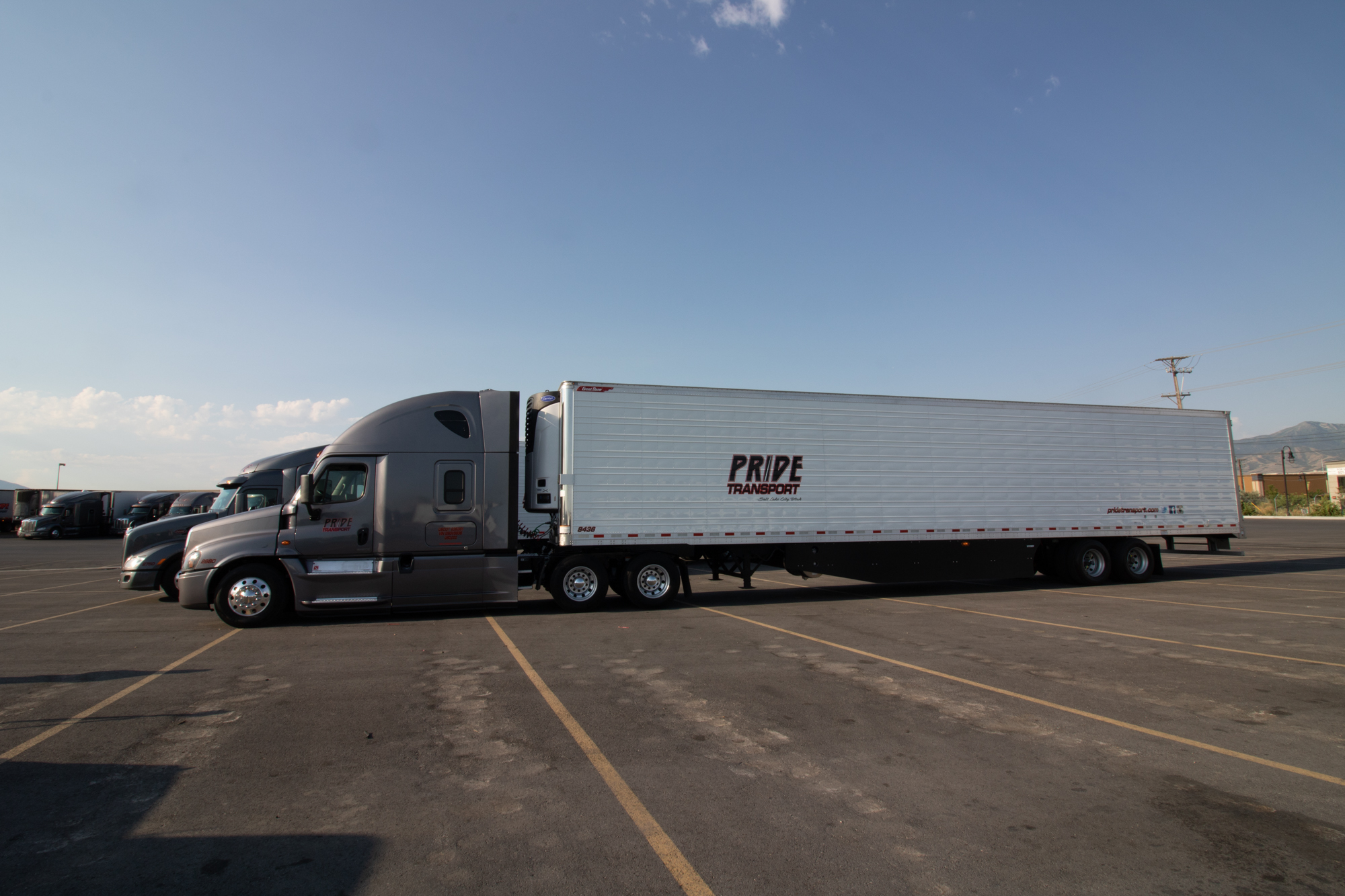 pride transport truck parked in company lot