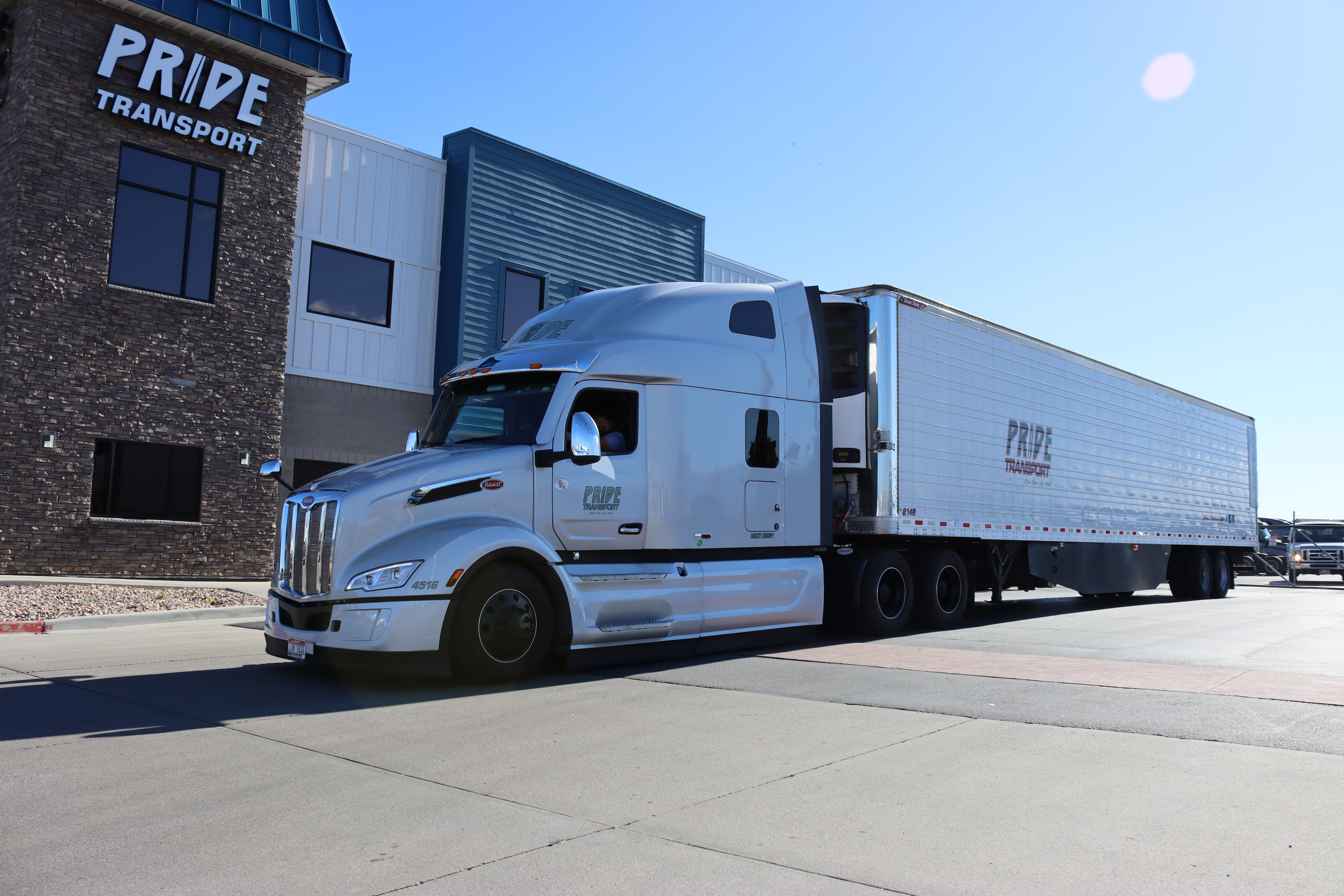 silver pride transport truck in front of headquarters