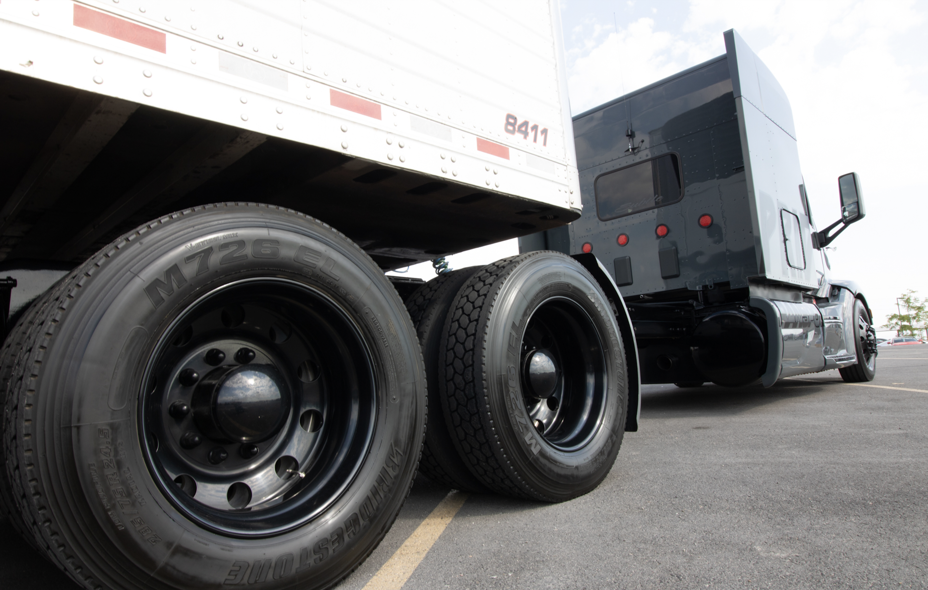 side and under view of pride transport truck with tires mainly in the frame