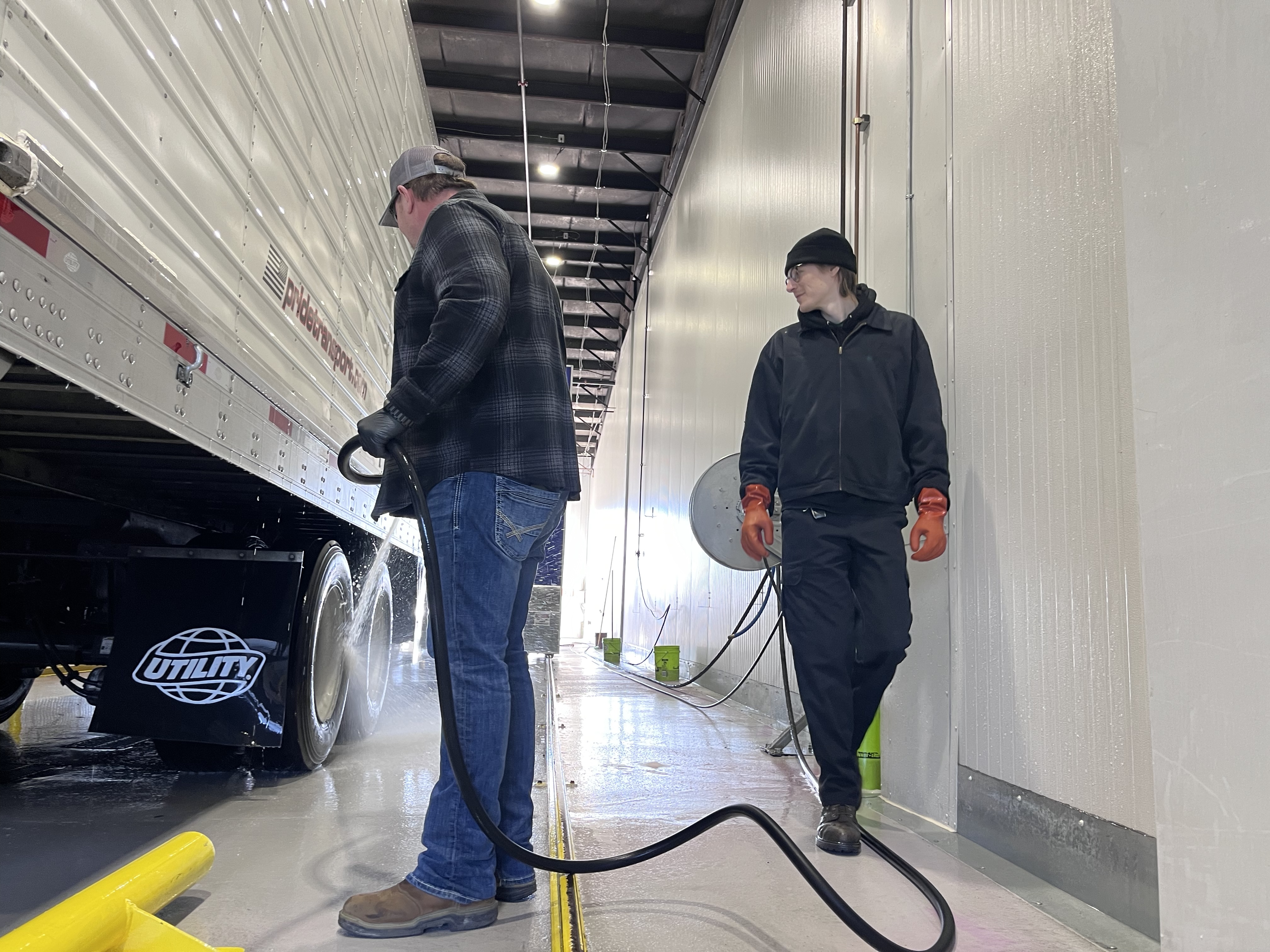 pride transport truck being cleaned in wash bay