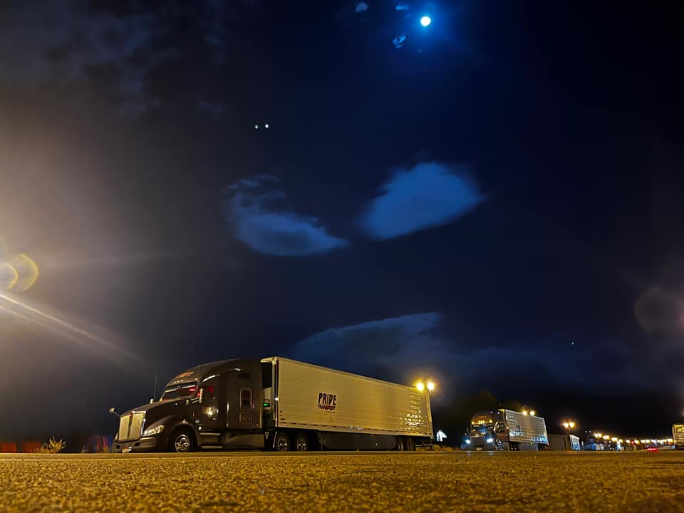 pride transport truck at night