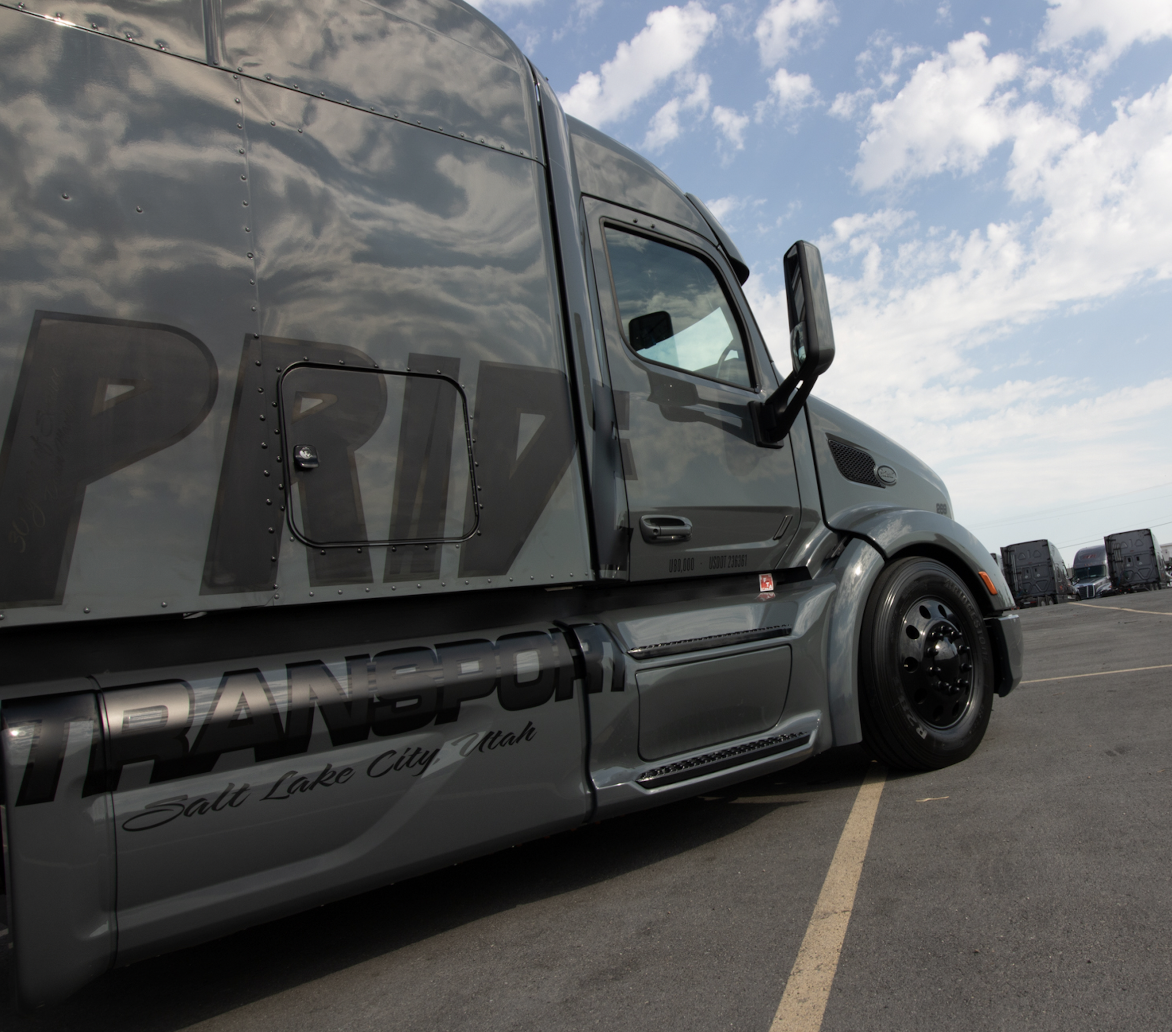 side view of pride transport truck in parking lot