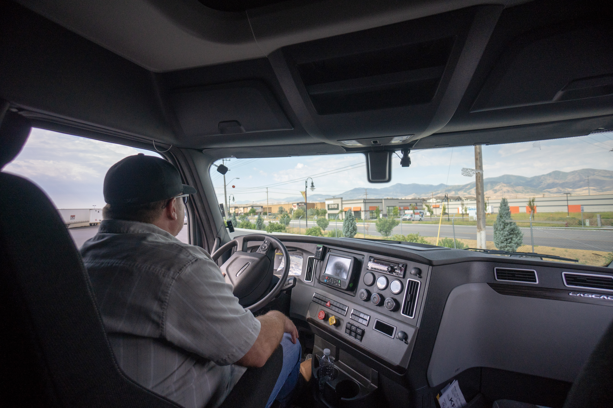 pride transport employee driving and looking out the front window