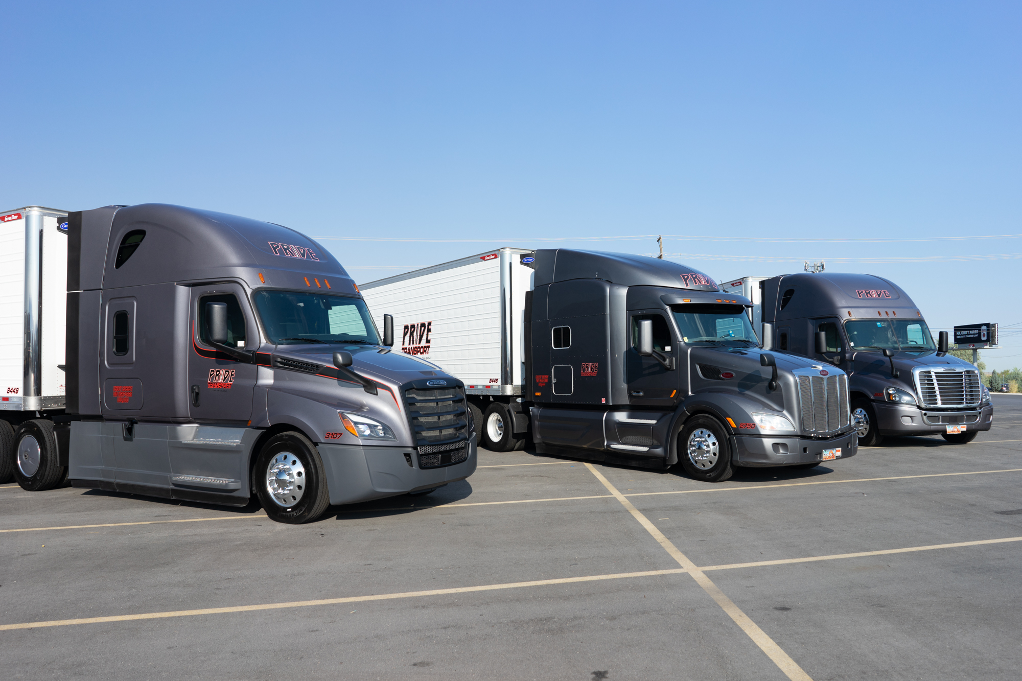 pride transport trucks in parking lot