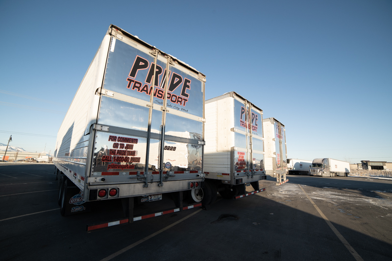 pride transport trucks parked