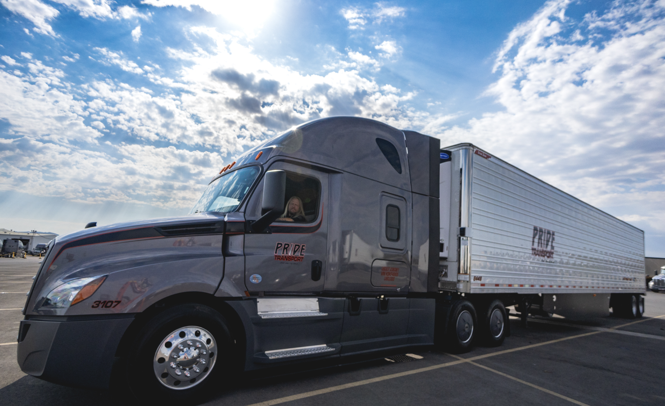 pride transport truck with driver