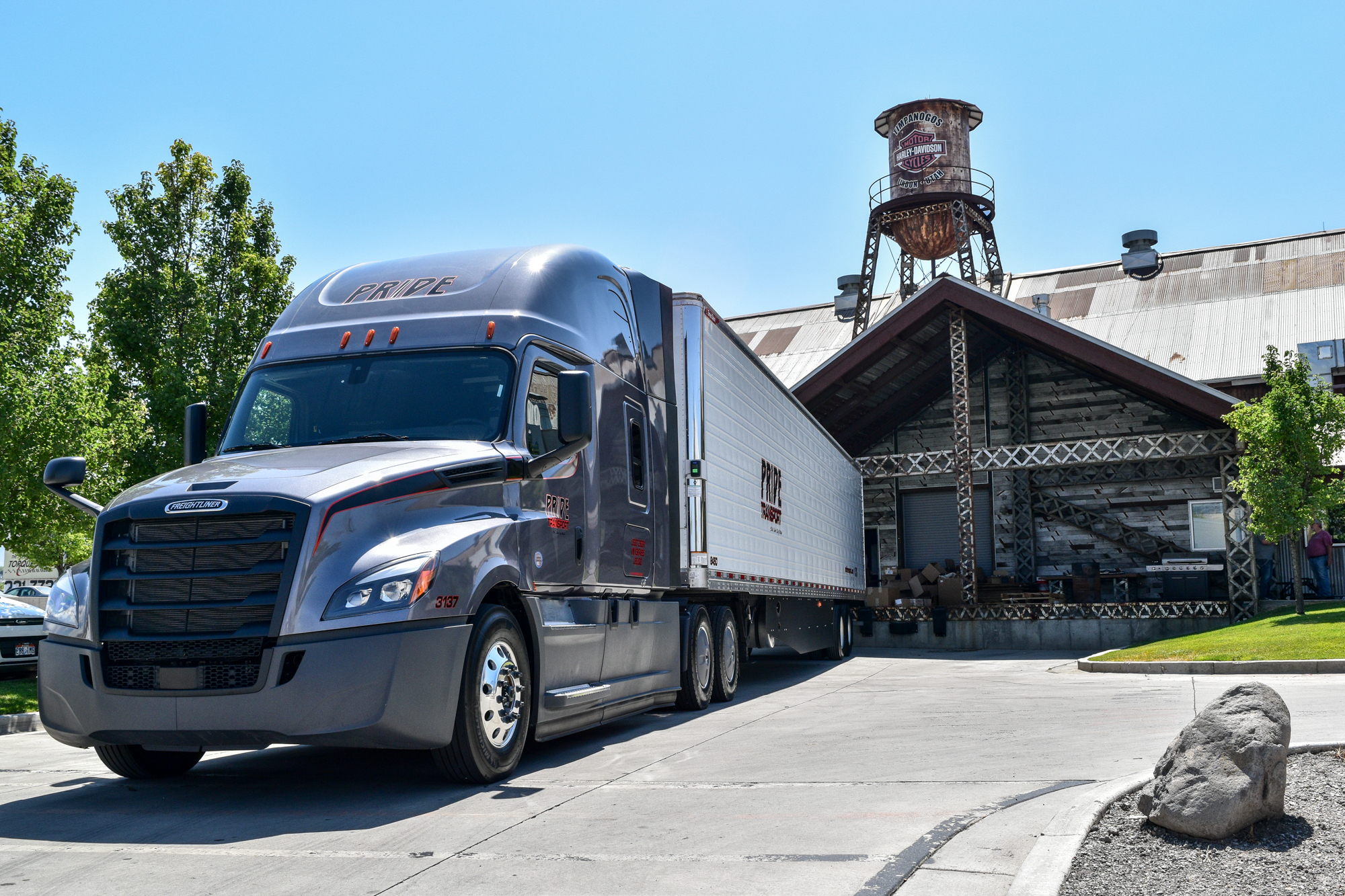 pride transport truck backed into a loading spot at harley davidson building