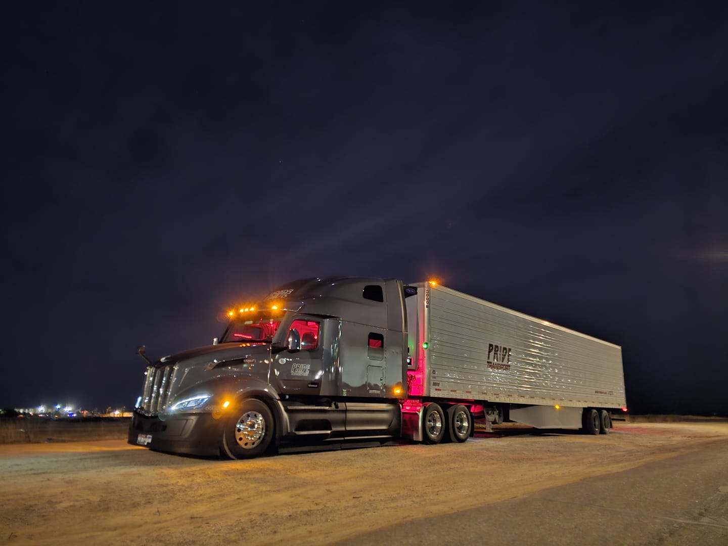 pride transport truck at night parked