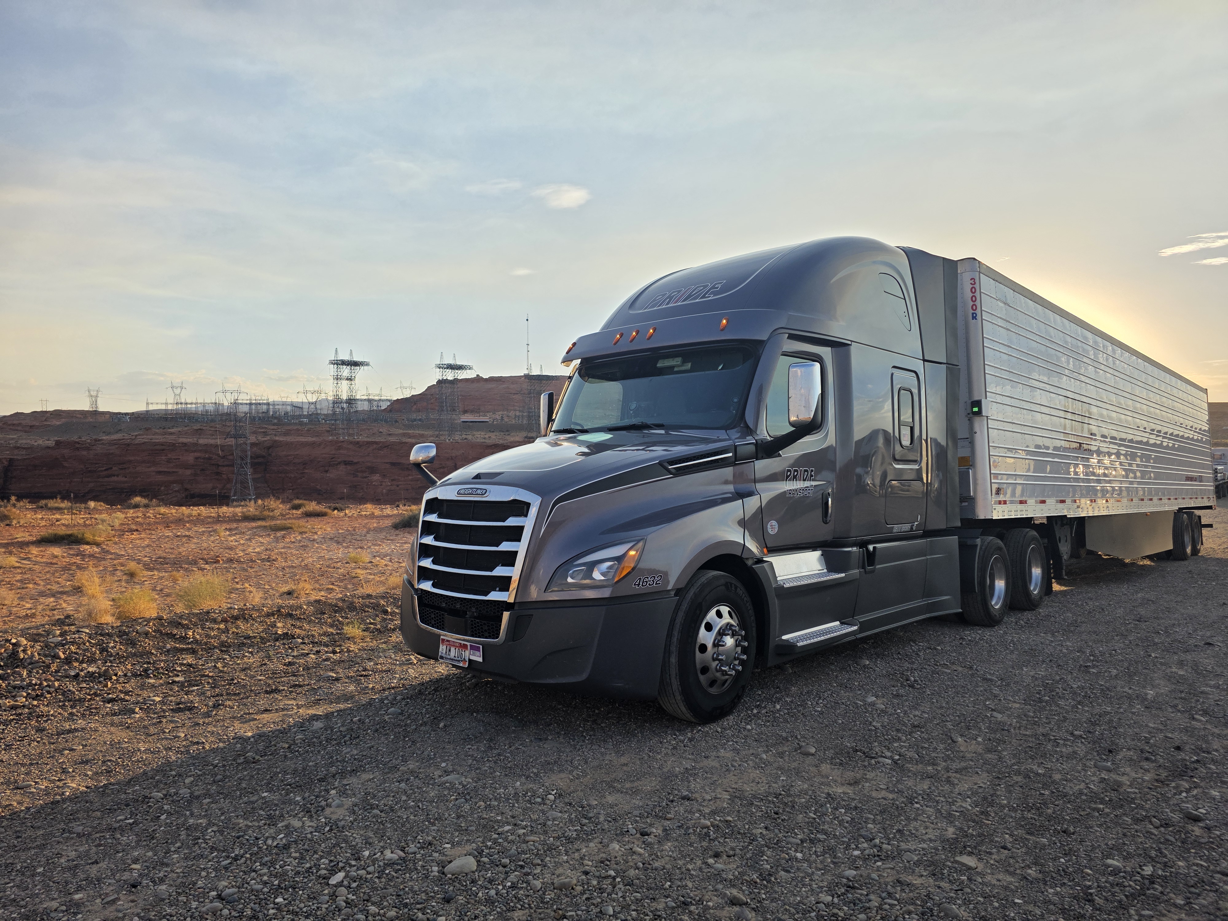 pride transport truck parked at dam