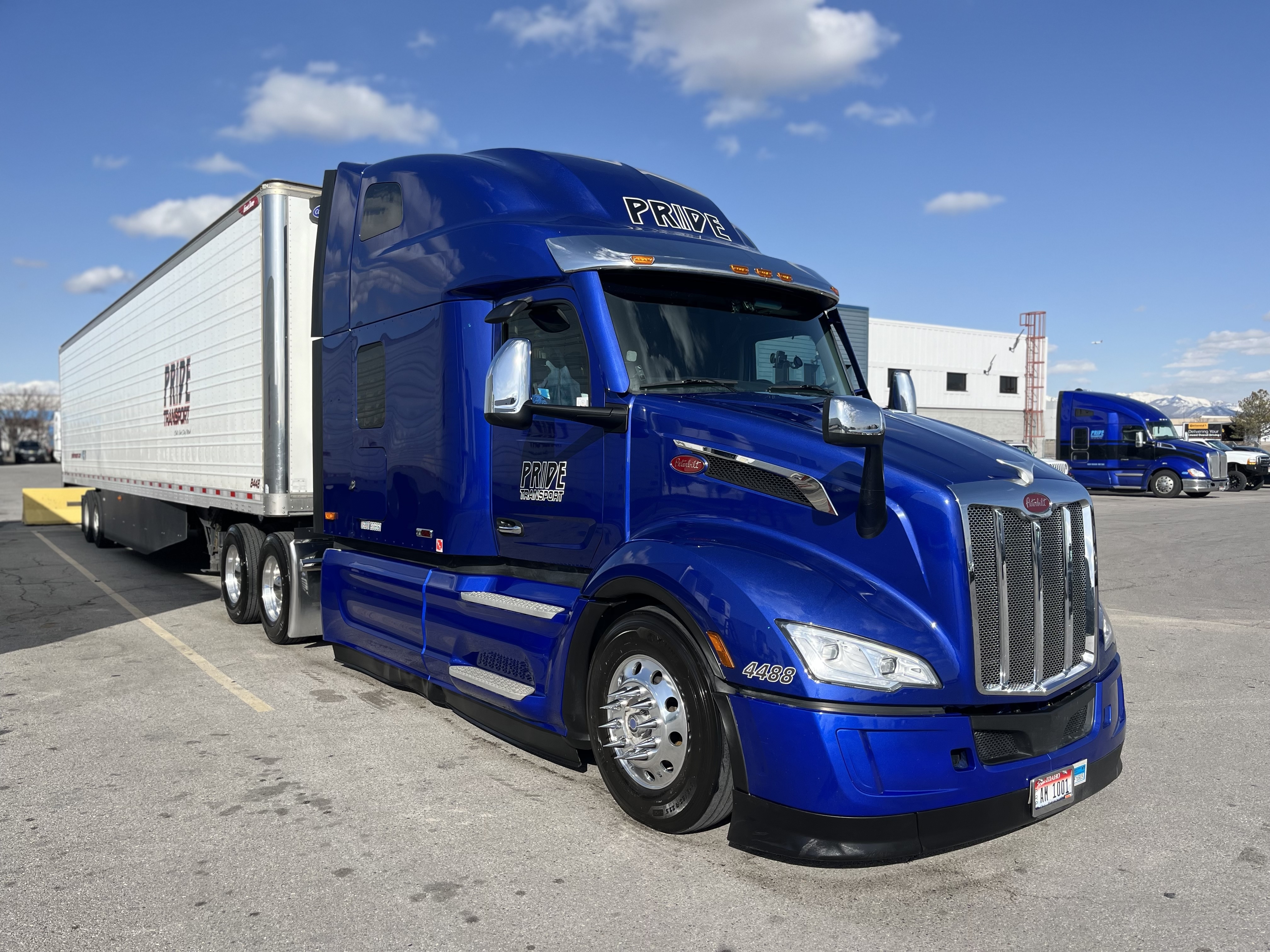 blue pride transport truck in parking lot