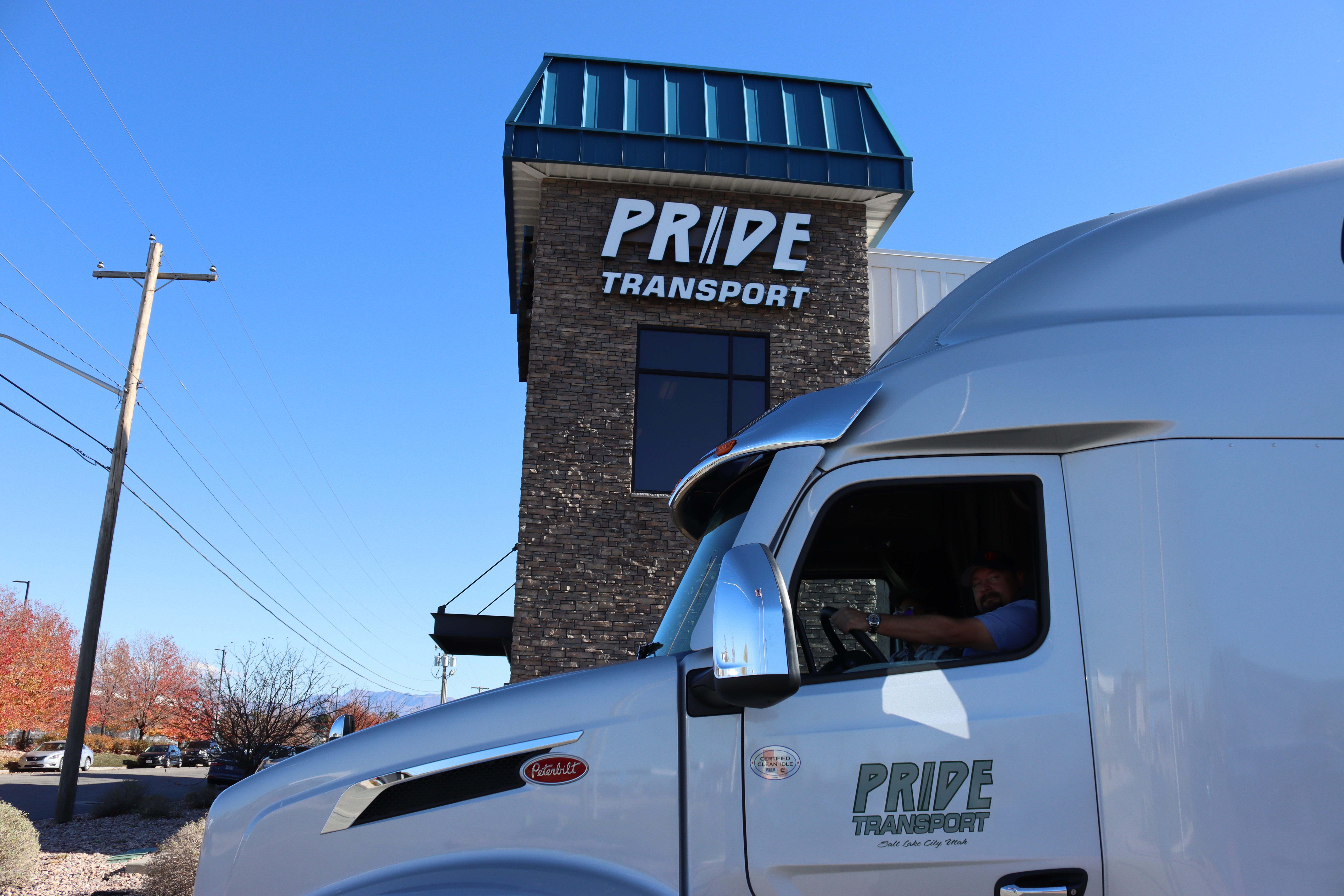 silver pride transport truck in front of pride headquarters