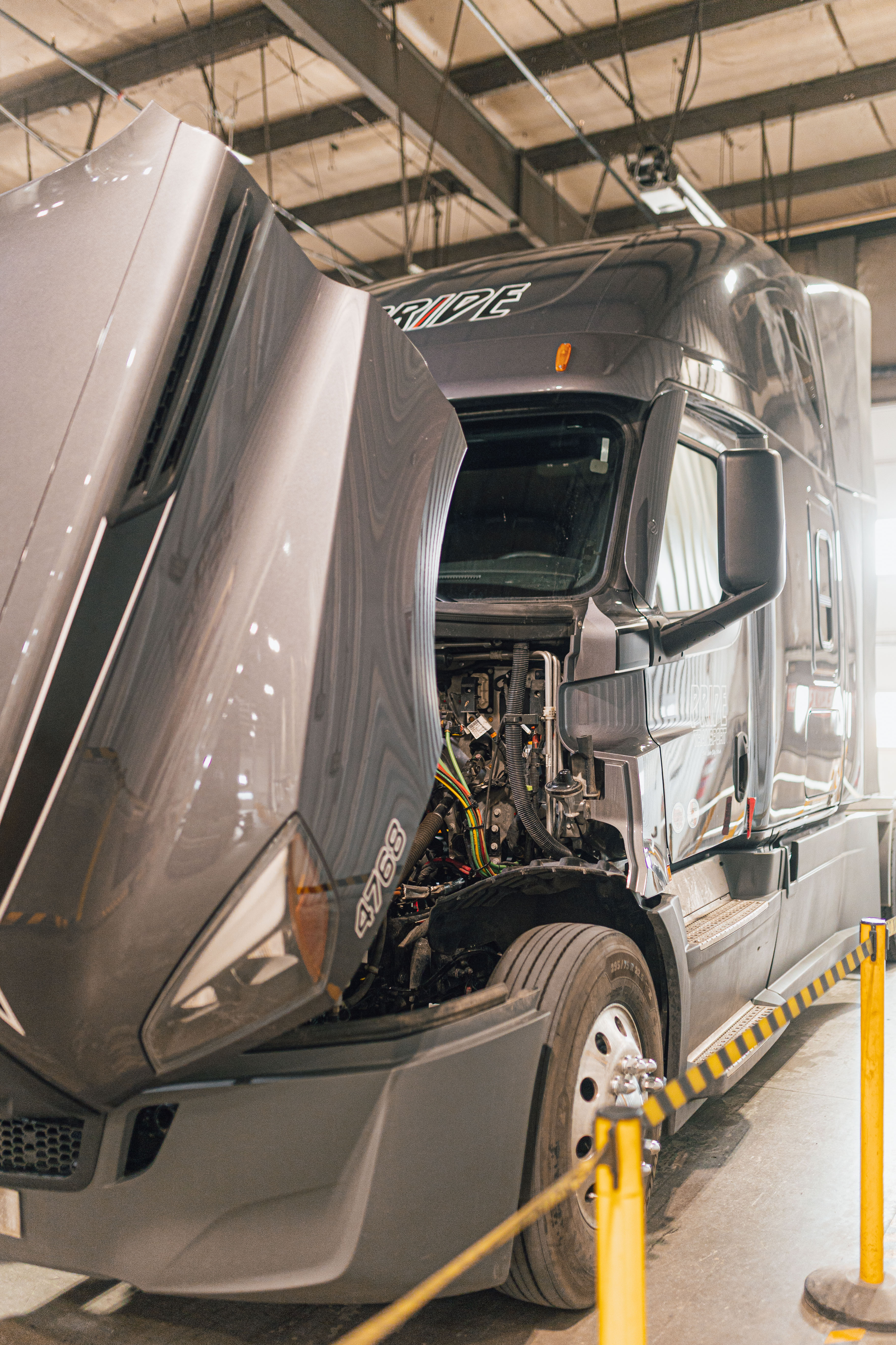 semi truck in pride transport maintenance shop