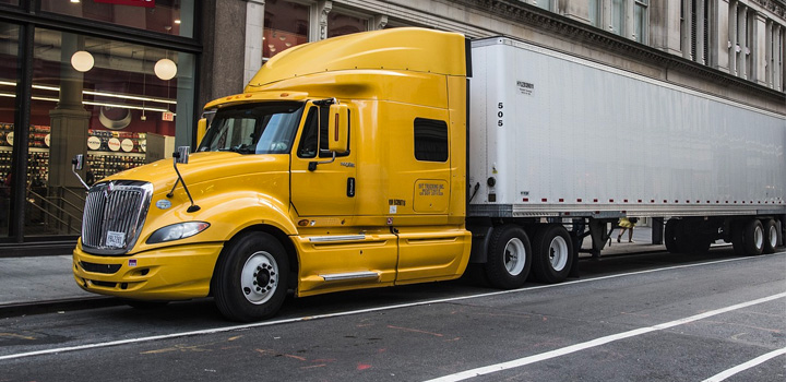 yellow semitruck in city